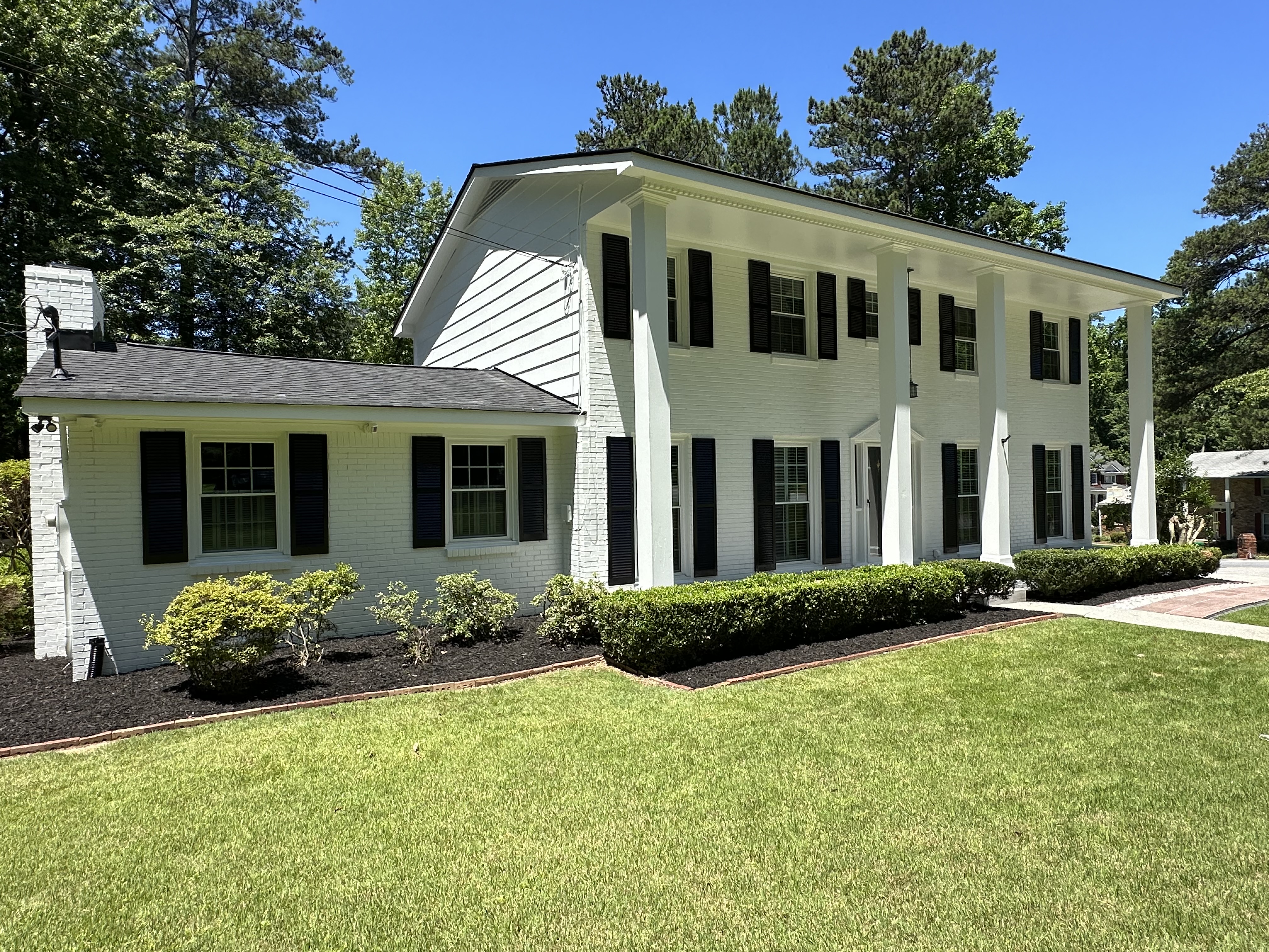 Front view of colonial home in Sandy Springs after painting
